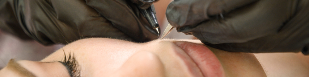 Gloved Hands Inserting Probe On Chin